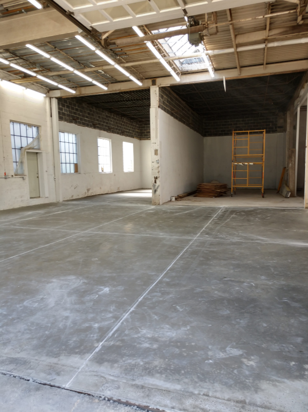 An industrial warehouse facility with a new concrete floor poured by Dornbrook Construction